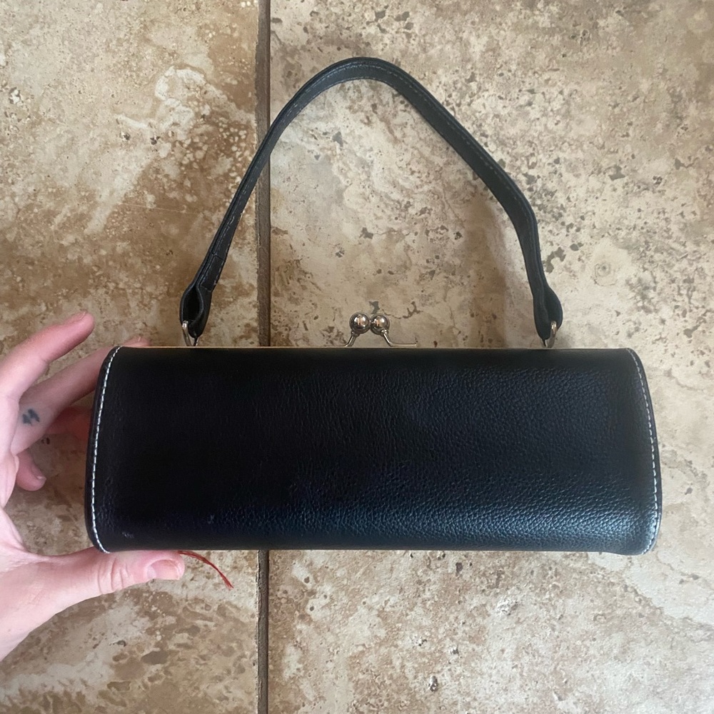 Mini cylinder clutch purse